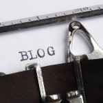 Typewriter ribbon typing "Blog"